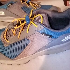 The North Face Blue and Gray Sneakers with Breathable Mesh and Durable Sole